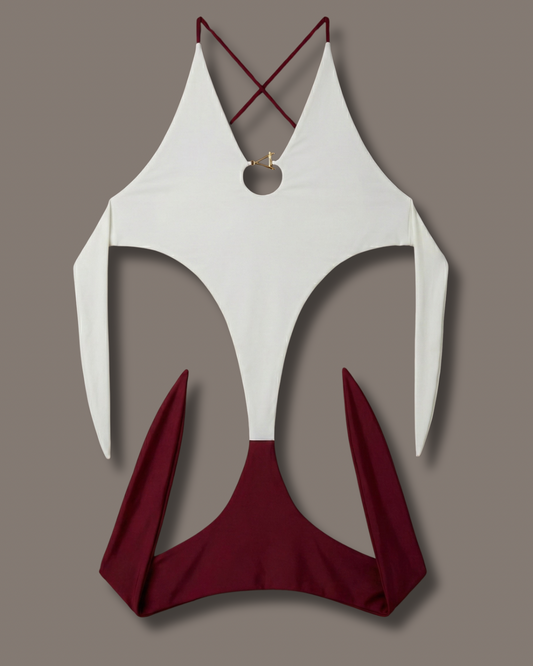 White and red swimsuit top on a gray background