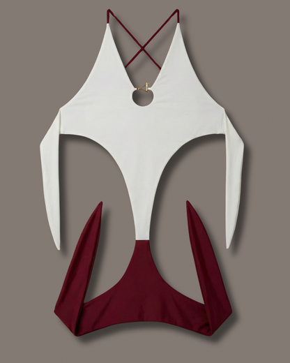 White and red swimsuit top on a gray background