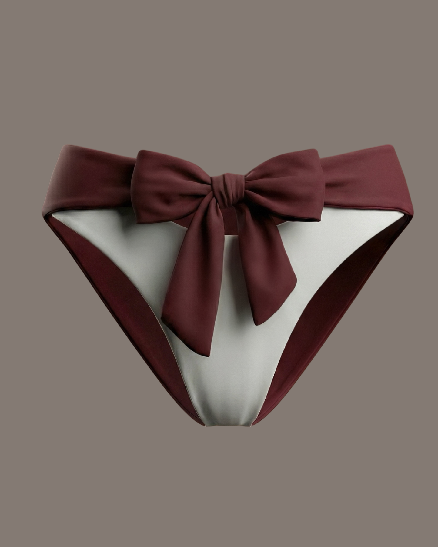 Bikini bottom with a large bow on a studio background