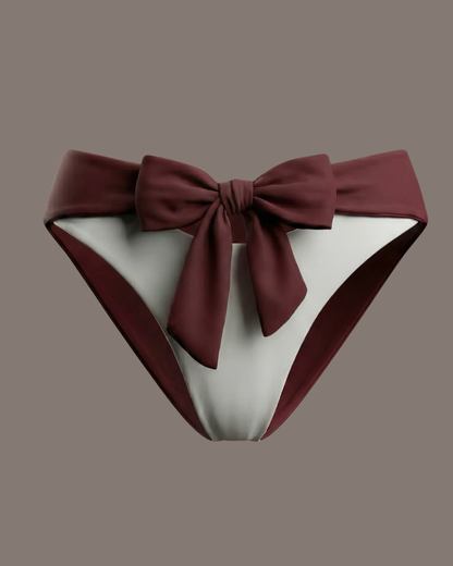 Bikini bottom with a large bow on a studio background