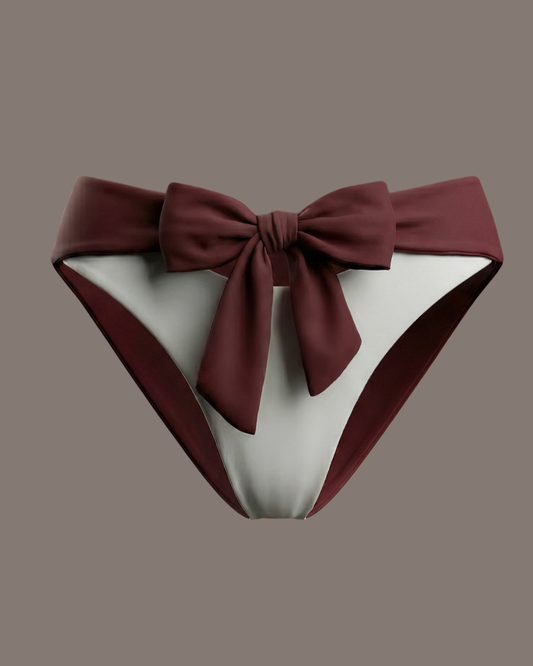 Bikini bottom with a large bow on a studio background